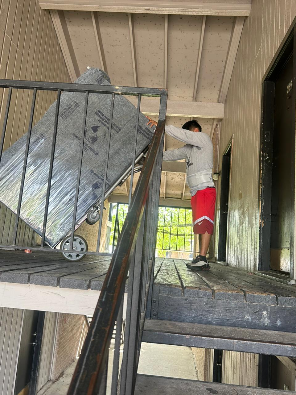 Criss Moving - Carrying furniture up stairs